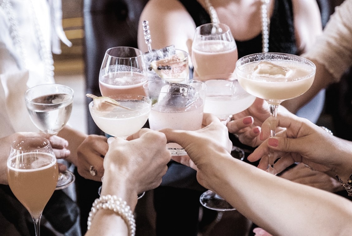 People toasting with wine glasses